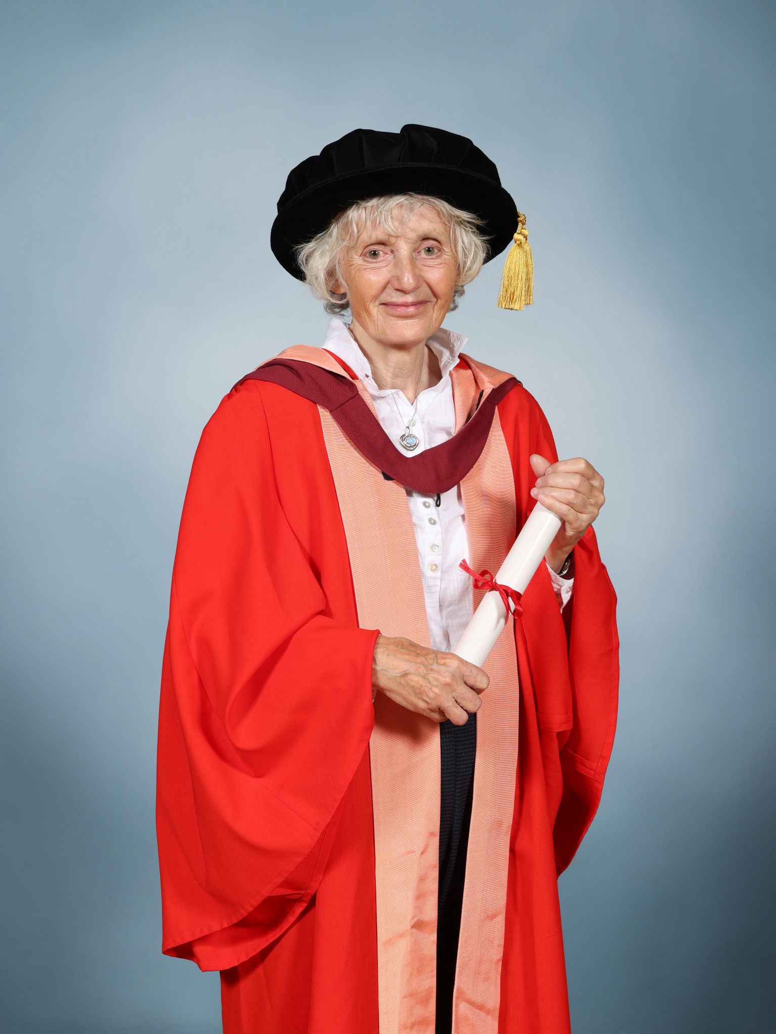 Dr Anna Glasier wearing a mortar board and holding a parchment